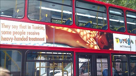 A bus in London carrying a showing an advert of a woman receiving a massage, next to the words: "They say that in Tunisia, some people receive heavy-handed treatment"